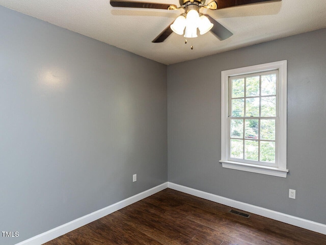 102 Sanair Ct, Apex, NC 27502 - empty room with healthy amount of natural light, baseboards, dark wood finished floors, and ceiling fan