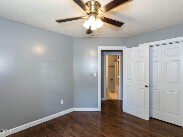 102 Sanair Ct, Apex, NC 27502 - unfurnished bedroom featuring dark wood finished floors, baseboards, a closet, a textured ceiling, and ceiling fan