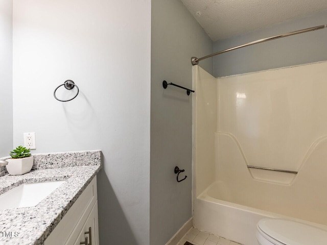 102 Sanair Ct, Apex, NC 27502 - bathroom featuring vanity, washtub / shower combination, toilet, tile patterned floors, and baseboards