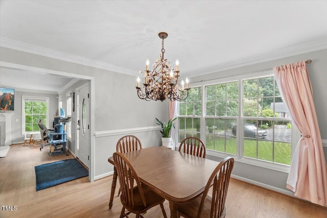 2750 Michelle Ct, Creedmoor, NC 27522 - dining space with a chandelier, wood finished floors, and crown molding