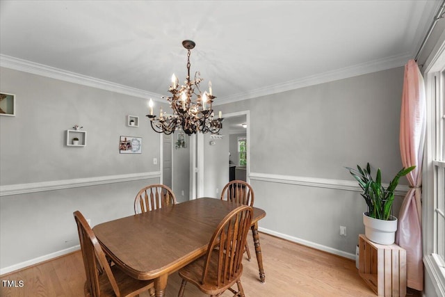 2750 Michelle Ct, Creedmoor, NC 27522 - dining space with light wood-style floors, a chandelier, and ornamental molding