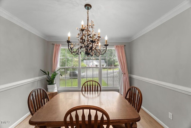 2750 Michelle Ct, Creedmoor, NC 27522 - dining area with a chandelier, plenty of natural light, light wood finished floors, and crown molding
