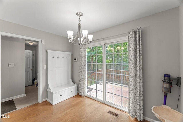 2750 Michelle Ct, Creedmoor, NC 27522 - unfurnished dining area with a chandelier and light wood finished floors