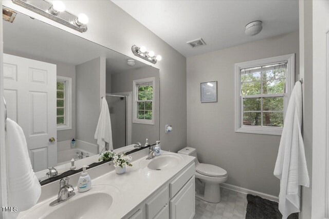 2750 Michelle Ct, Creedmoor, NC 27522 - bathroom featuring a stall shower, healthy amount of natural light, double vanity, and a garden tub