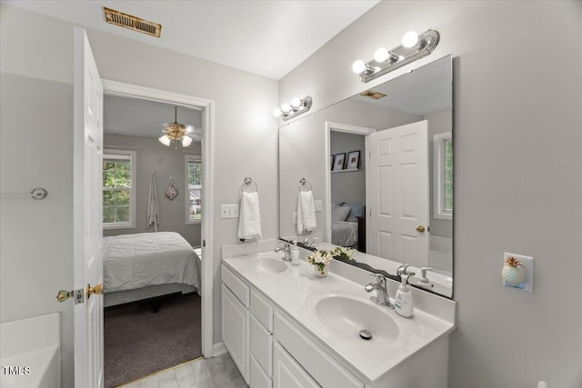 2750 Michelle Ct, Creedmoor, NC 27522 - bathroom featuring connected bathroom, double vanity, and ceiling fan