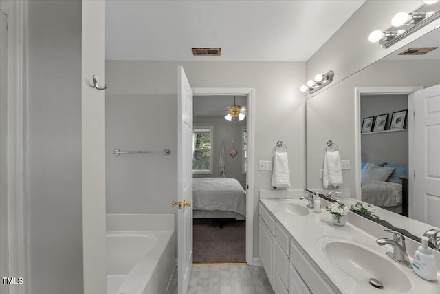 2750 Michelle Ct, Creedmoor, NC 27522 - ensuite bathroom with double vanity, a tub, and ceiling fan