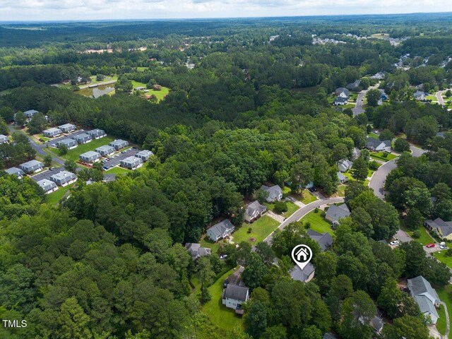 2750 Michelle Ct, Creedmoor, NC 27522 - aerial overview of property's location with a heavily wooded area and nearby suburban area