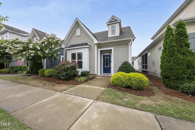 6313 Kayton St, Raleigh, NC 27616 - view of front facade featuring a standing seam roof and roof with shingles