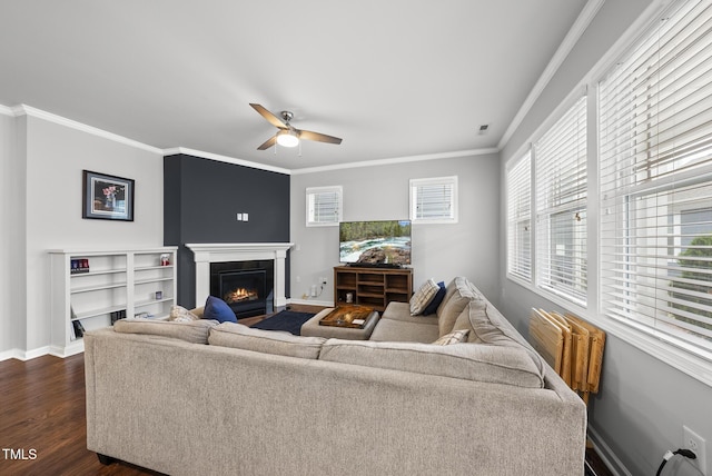 6313 Kayton St, Raleigh, NC 27616 - living room featuring ceiling fan, a fireplace with flush hearth, ornamental molding, baseboards, and dark wood-type flooring