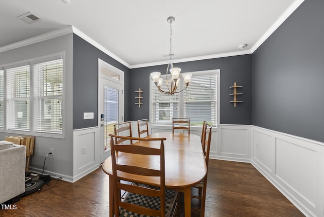 6313 Kayton St, Raleigh, NC 27616 - dining room featuring a chandelier, wainscoting, dark wood finished floors, and ornamental molding