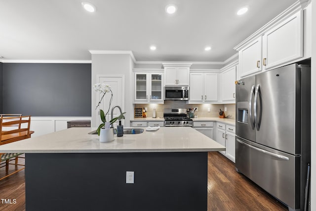 6313 Kayton St, Raleigh, NC 27616 - kitchen featuring stainless steel appliances, crown molding, a sink, white cabinets, and glass insert cabinets