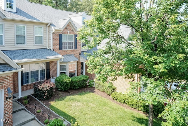 11217 Maplecroft Ct, Raleigh, NC 27617 - view of side of home featuring roof with shingles, brick siding, and a yard