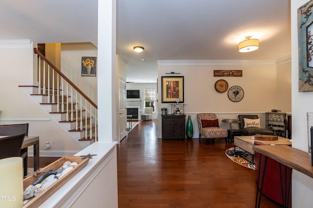 11217 Maplecroft Ct, Raleigh, NC 27617 - living area featuring stairway, dark wood-style flooring, a fireplace, and crown molding