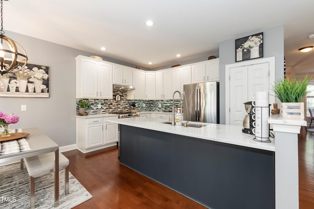 11217 Maplecroft Ct, Raleigh, NC 27617 - kitchen featuring freestanding refrigerator, a sink, backsplash, dark wood-style floors, and a chandelier