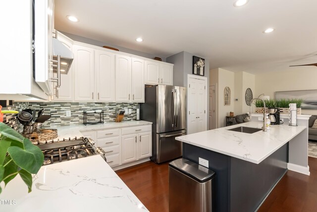 11217 Maplecroft Ct, Raleigh, NC 27617 - kitchen with freestanding refrigerator, a sink, dark wood finished floors, white cabinets, and backsplash