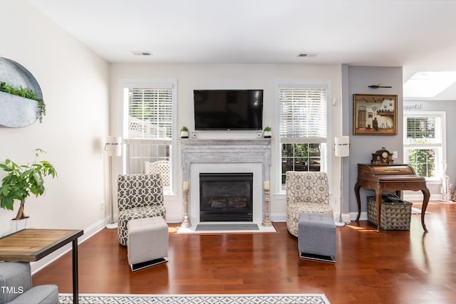 11217 Maplecroft Ct, Raleigh, NC 27617 - living area with wood finished floors, a fireplace with flush hearth, and baseboards