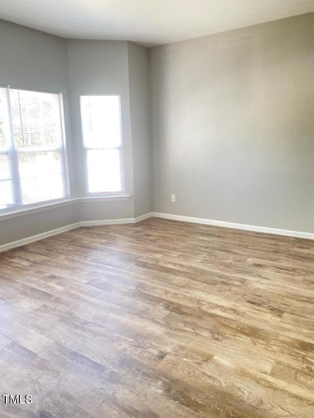 3207 Geary Trl, Raleigh, NC 27610 - empty room featuring wood finished floors and baseboards