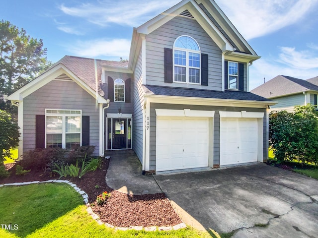 117 Brierridge Dr, Apex, NC 27502 - traditional-style home with an attached garage, driveway, and a shingled roof
