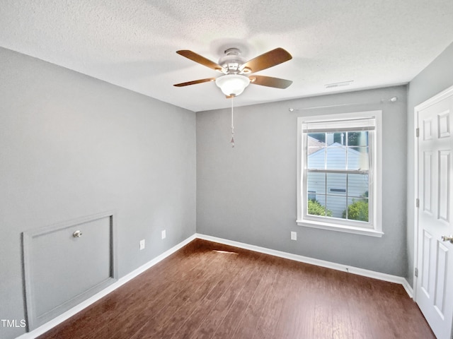 117 Brierridge Dr, Apex, NC 27502 - unfurnished room featuring ceiling fan, dark wood-type flooring, baseboards, and a textured ceiling