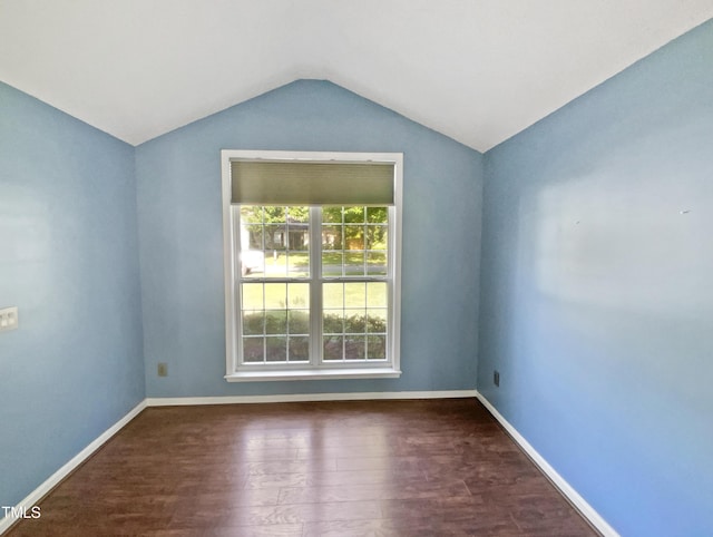 117 Brierridge Dr, Apex, NC 27502 - spare room featuring vaulted ceiling, wood finished floors, and baseboards