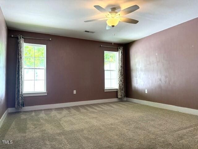 820 Houston Ct, Haw River, NC 27258 - unfurnished room featuring healthy amount of natural light, carpet flooring, ceiling fan, and baseboards