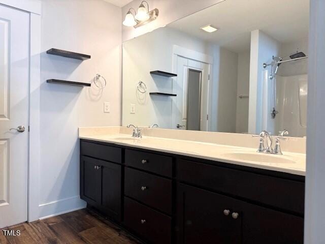 820 Houston Ct, Haw River, NC 27258 - bathroom featuring double vanity, wood finished floors, baseboards, and a shower
