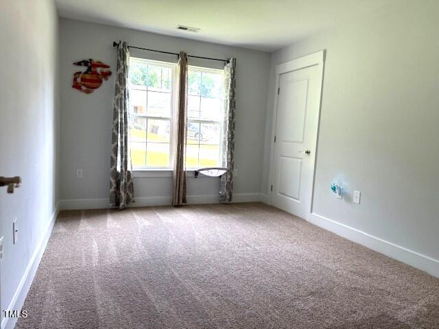 820 Houston Ct, Haw River, NC 27258 - spare room featuring carpet and baseboards