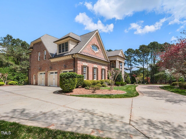 5768 Cavanaugh Dr, Raleigh, NC 27614 - view of side of property with an attached garage, brick siding, driveway, and a shingled roof