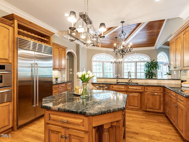 5768 Cavanaugh Dr, Raleigh, NC 27614 - kitchen featuring appliances with stainless steel finishes, wood ceiling, a chandelier, crown molding, and a warming drawer