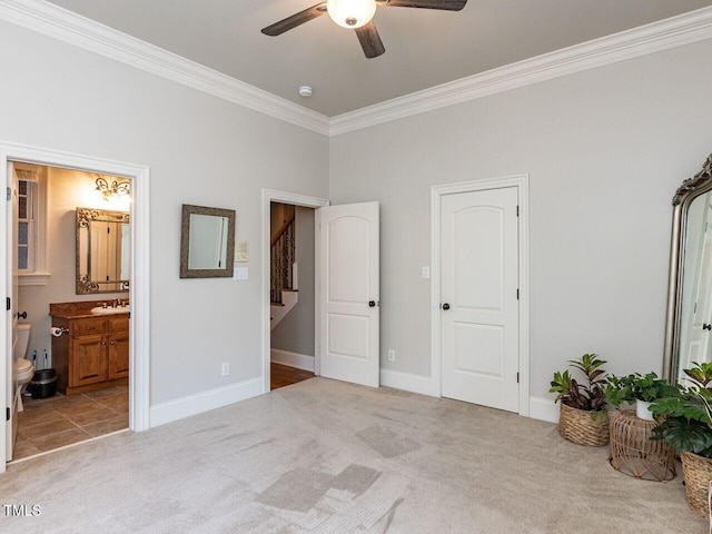 5768 Cavanaugh Dr, Raleigh, NC 27614 - carpeted bedroom featuring crown molding, ensuite bath, and ceiling fan