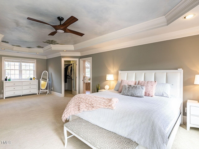 5768 Cavanaugh Dr, Raleigh, NC 27614 - bedroom featuring a tray ceiling, crown molding, carpet, a spacious closet, and a ceiling fan