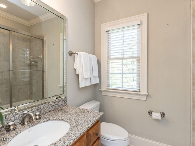 5768 Cavanaugh Dr, Raleigh, NC 27614 - full bath featuring a shower stall, vanity, and crown molding
