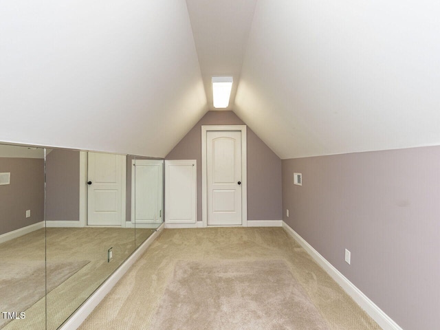 5768 Cavanaugh Dr, Raleigh, NC 27614 - additional living space featuring light carpet and vaulted ceiling