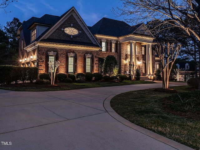5768 Cavanaugh Dr, Raleigh, NC 27614 - view of front of property featuring brick siding and curved driveway