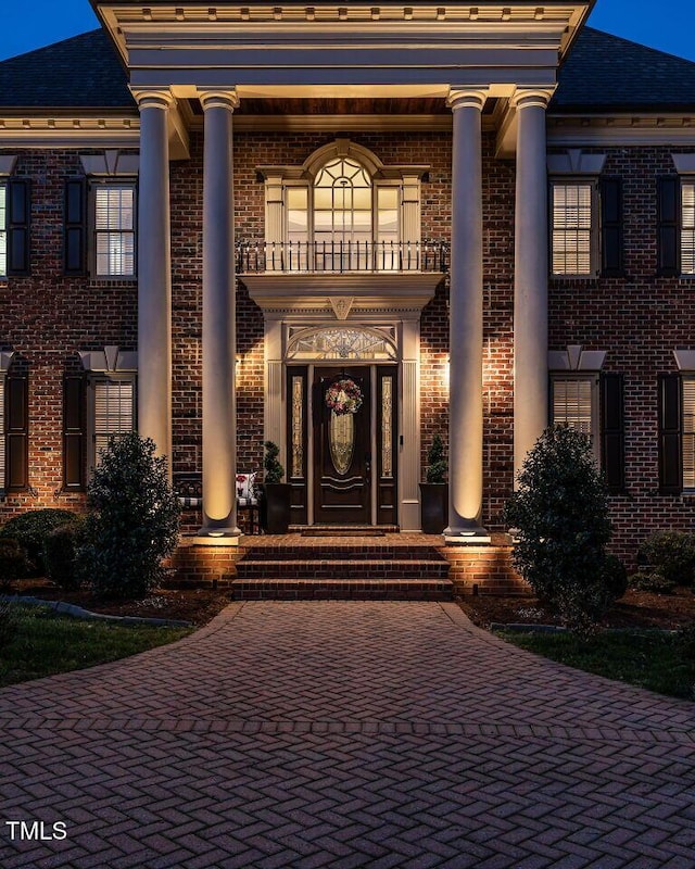 5768 Cavanaugh Dr, Raleigh, NC 27614 - entrance to property featuring a balcony and brick siding