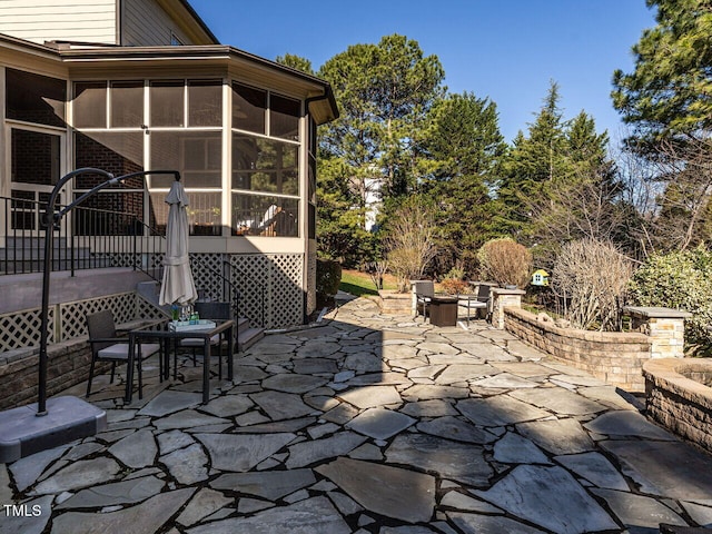 5768 Cavanaugh Dr, Raleigh, NC 27614 - view of patio / terrace with a sunroom, a fire pit, and outdoor dining space