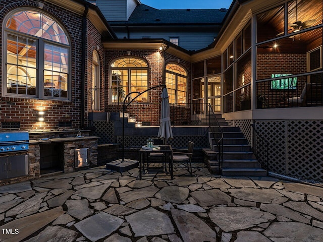 5768 Cavanaugh Dr, Raleigh, NC 27614 - view of patio / terrace featuring exterior kitchen, stairs, and a sunroom