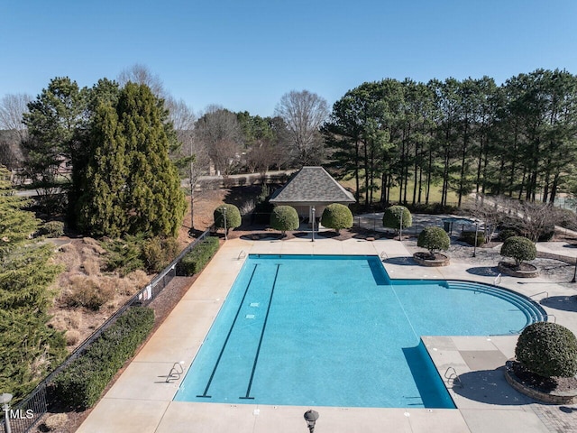 5768 Cavanaugh Dr, Raleigh, NC 27614 - community pool with view of wooded area, a gazebo, and a patio area