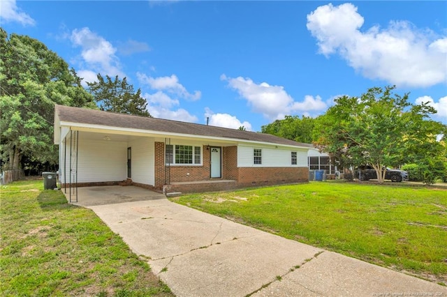 4709 Alamance Rd, Fayetteville, NC 28304 - ranch-style home featuring brick siding, concrete driveway, a front yard, and an attached carport