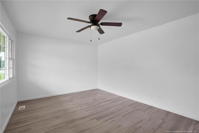 4709 Alamance Rd, Fayetteville, NC 28304 - unfurnished room with healthy amount of natural light and wood finished floors