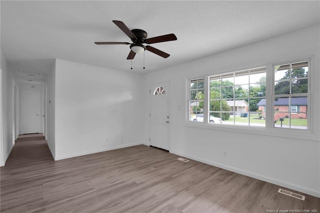 4709 Alamance Rd, Fayetteville, NC 28304 - empty room with wood finished floors, ceiling fan, and baseboards