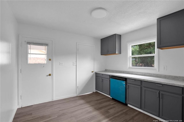 4709 Alamance Rd, Fayetteville, NC 28304 - kitchen featuring dishwashing machine, gray cabinets, dark wood-type flooring, and a textured ceiling