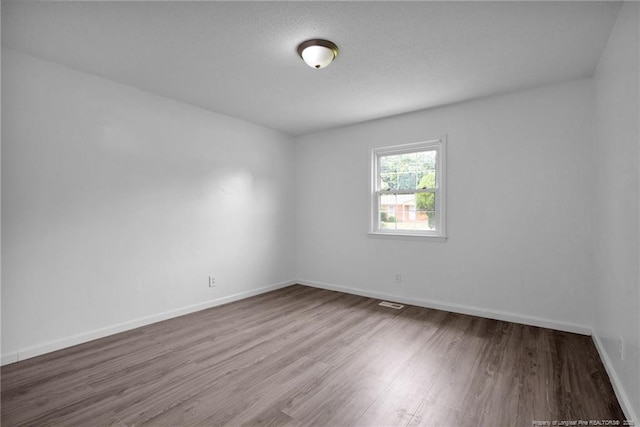 4709 Alamance Rd, Fayetteville, NC 28304 - empty room featuring wood finished floors and baseboards