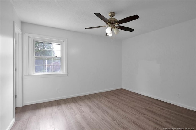 4709 Alamance Rd, Fayetteville, NC 28304 - unfurnished room with wood finished floors, ceiling fan, and baseboards