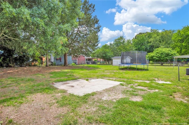 4709 Alamance Rd, Fayetteville, NC 28304 - view of yard featuring a trampoline and a patio area