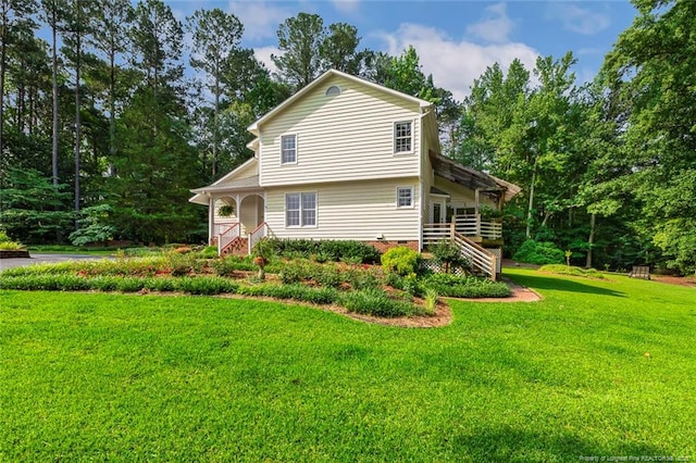 1718 Carthage St, Sanford, NC 27330 - view of front facade with a front yard