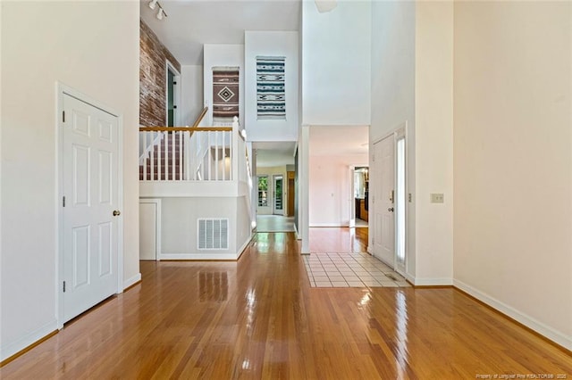 1718 Carthage St, Sanford, NC 27330 - entryway with a towering ceiling, hardwood / wood-style floors, baseboards, and stairway