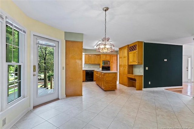 1718 Carthage St, Sanford, NC 27330 - kitchen with dishwasher, stainless steel microwave, light tile patterned floors, and light countertops