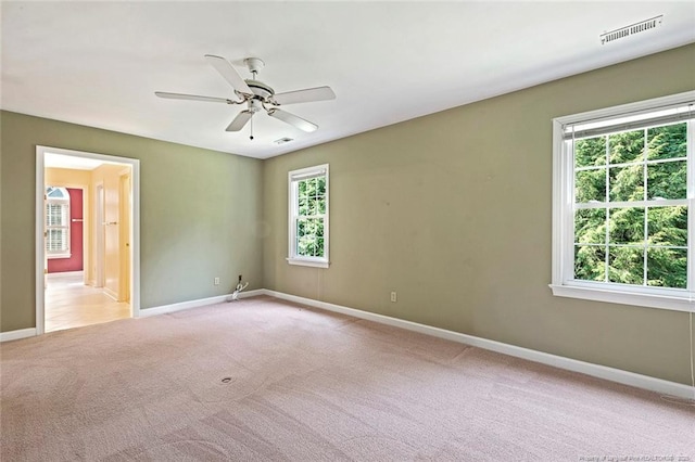 1718 Carthage St, Sanford, NC 27330 - unfurnished room with light carpet, baseboards, and a ceiling fan