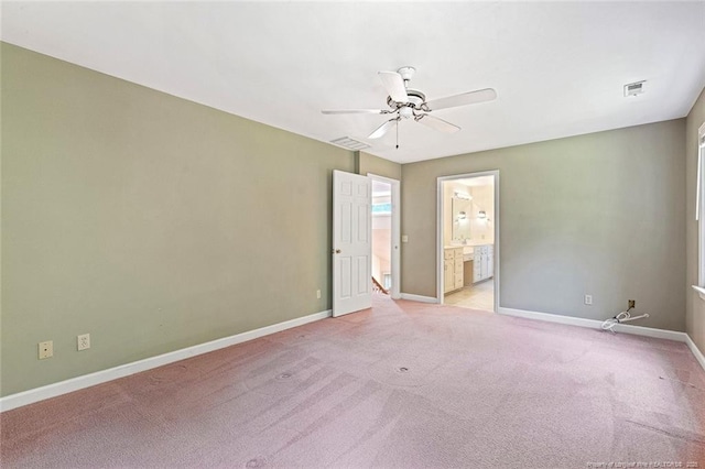 1718 Carthage St, Sanford, NC 27330 - empty room featuring light carpet, ceiling fan, and baseboards